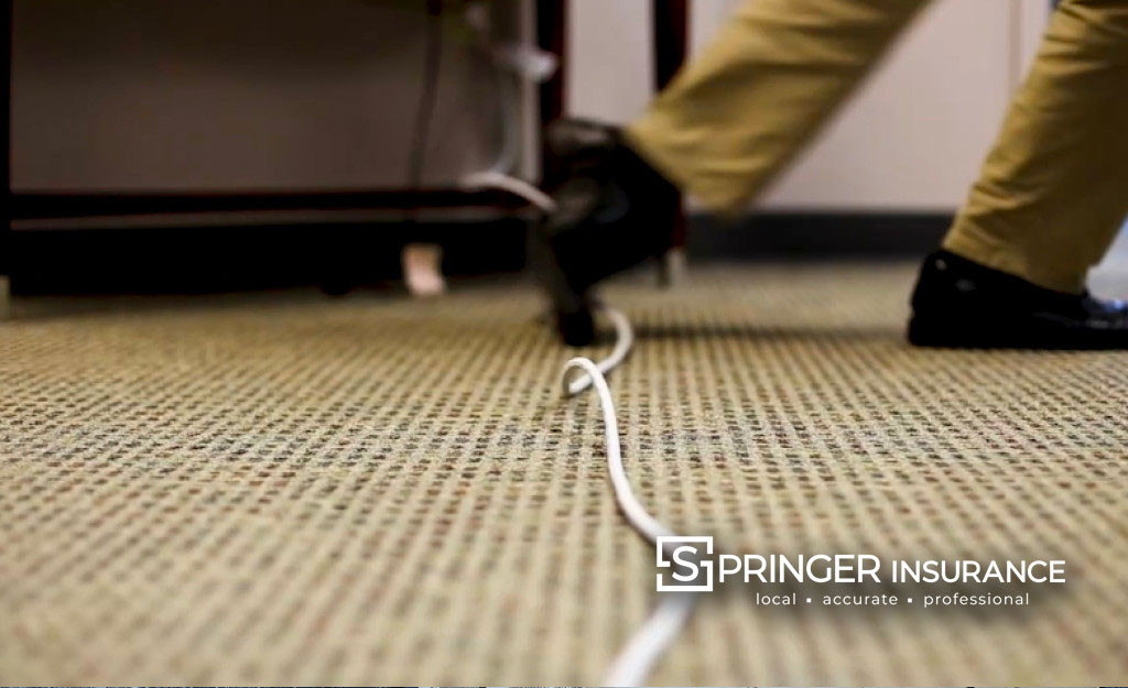 A person trips over a cord -This is actually Chris Leitch - we were filming a trip and fall video... he was not injured!