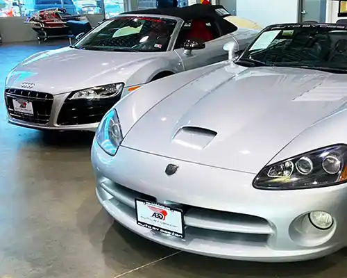 An Audi TT and a Dodge Viper in a Car showroom