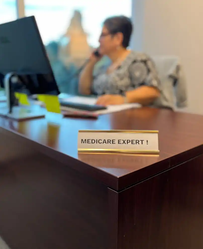 An out of focus image of Lisa Mims on the phone