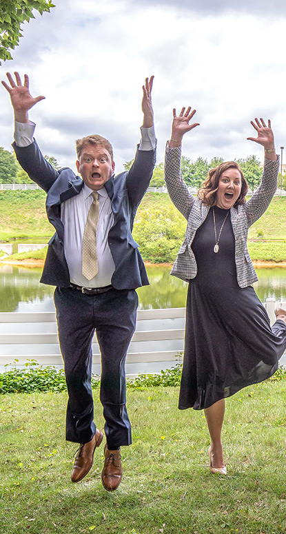 Two of our agents jumping for a picture - we have fun!
