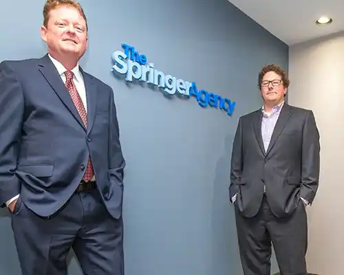 Chris Leitch and Nick Springer standing in the lobby of the Commonwealth Centre Office