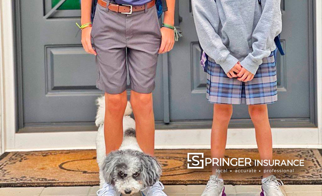 Two Kids and a mini-sheepadoodle getting ready for the first day back