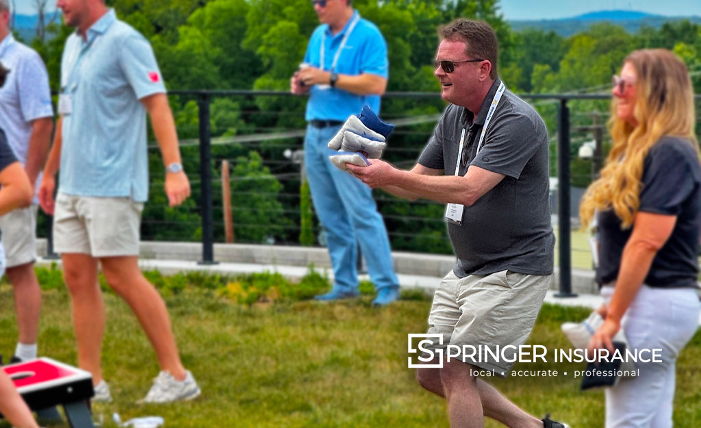 Chris Leitch playing Cornhole for the Special Olympics Fundraiser by the PIA of VA and DC