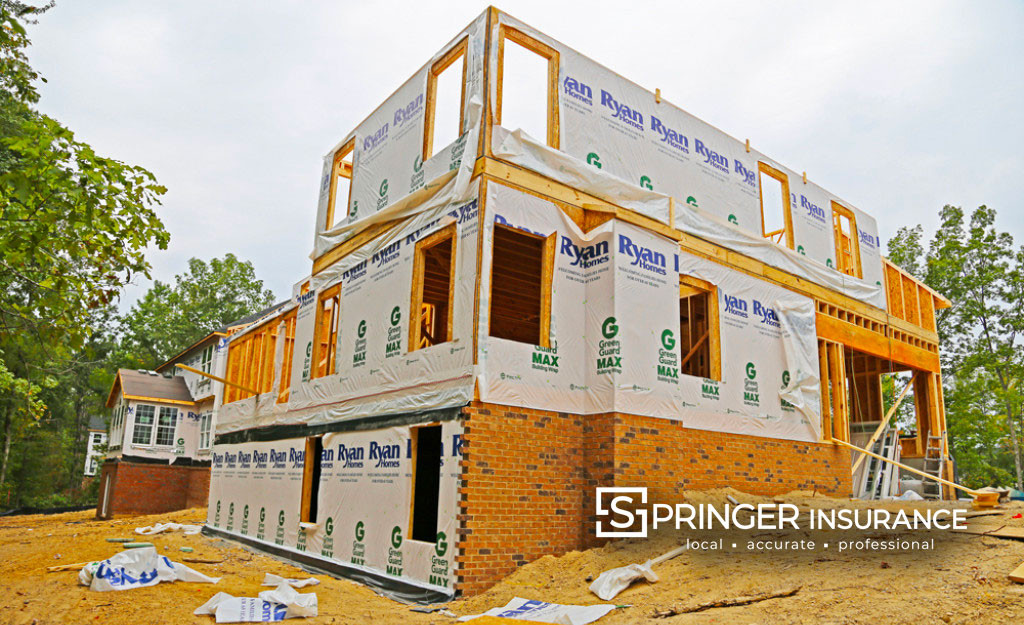 A house under wrap in Foxcreek